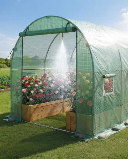 Open door of tunnel greenhouse with built-in sprinkler system watering rose plants inside